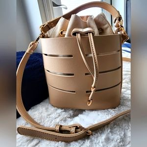 New Without Tags. Urban expressions bucket crossbody with handle.faux leather